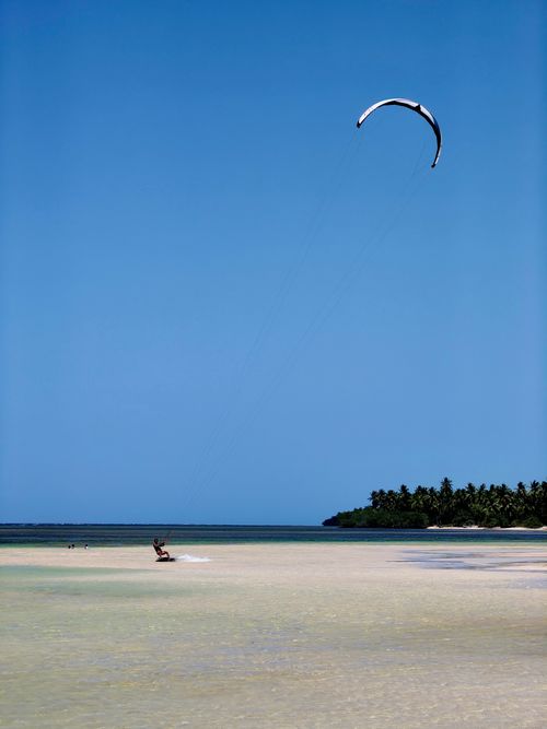 Free A thrilling kitesurfing scene on a sunny beach in Samaná, Dominican Republic. Stock Photo