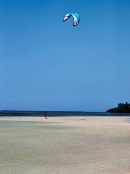 Kiteboarder enjoying the serene beaches of Samaná, Dominican Republic.