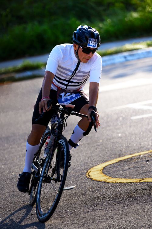 Free Adult cyclist racing on a sunny day in San Francisco de Campeche, México, showcasing endurance and competitive spirit. Stock Photo