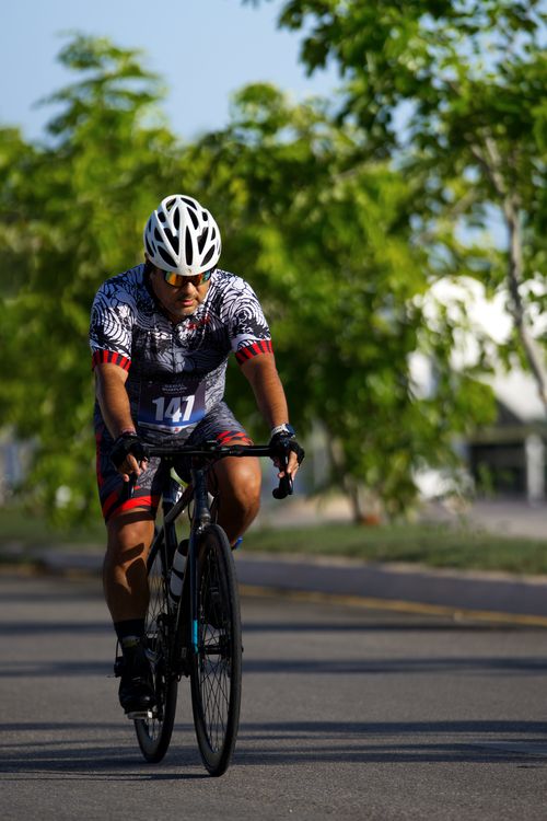 Free Competitive cyclist rides through San Francisco de Campeche, showcasing athleticism and dedication. Stock Photo
