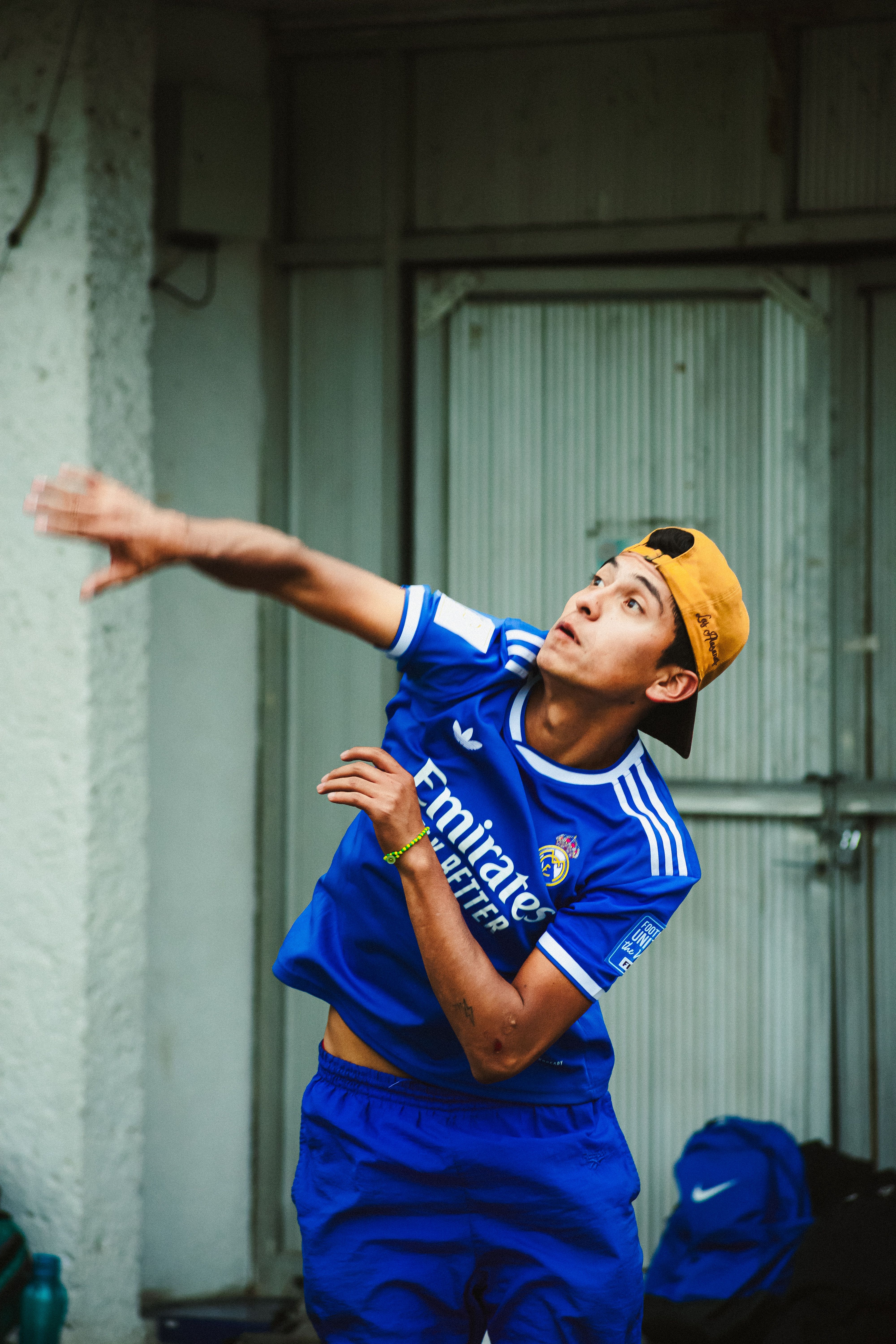 Young athlete in action playing volleyball indoors, showcasing dynamic movement and focus.