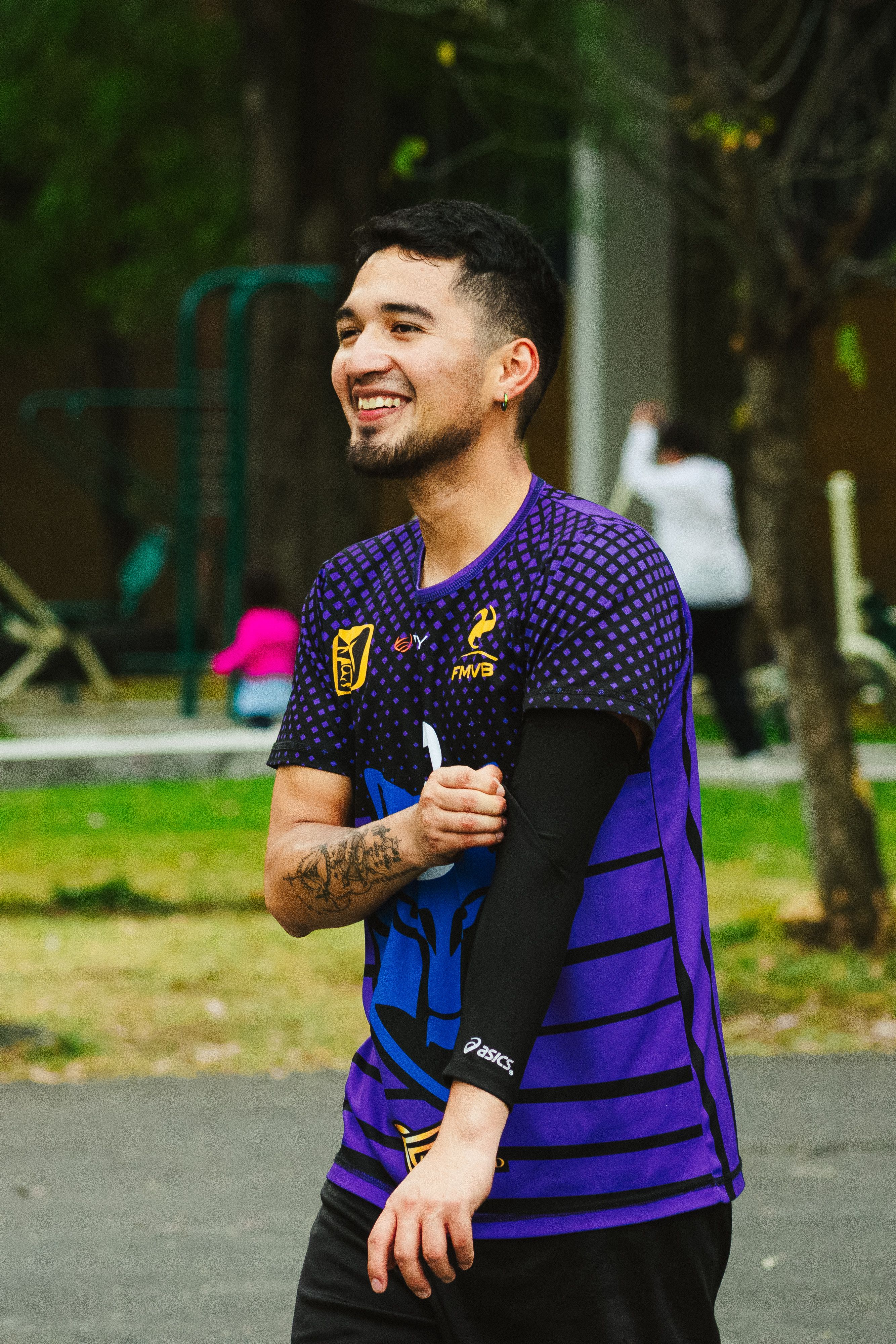 Smiling young man in sports attire engaged in outdoor activity, Ciudad de México.