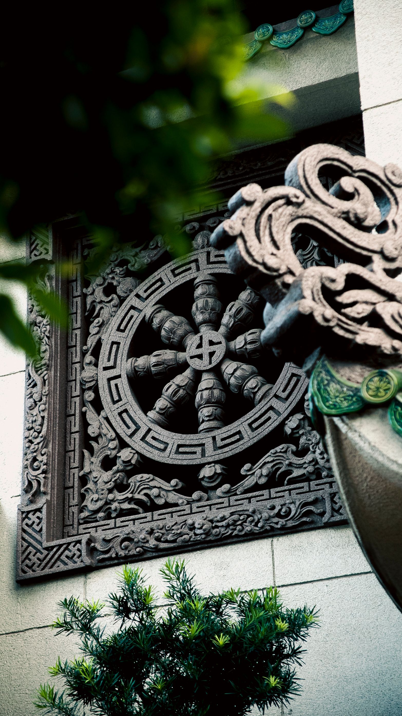 Detailed view of traditional Vietnamese architectural ornament in Ho Chi Minh City.