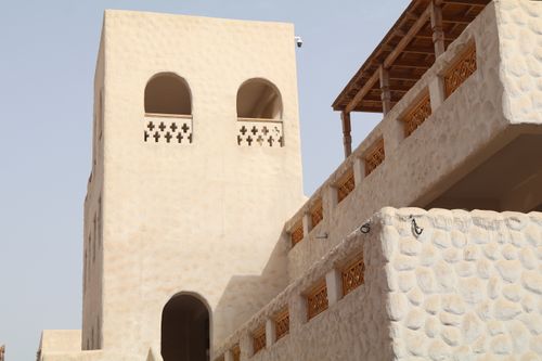 Free A beautiful example of traditional Middle Eastern architecture with unique stonework and arches. Stock Photo