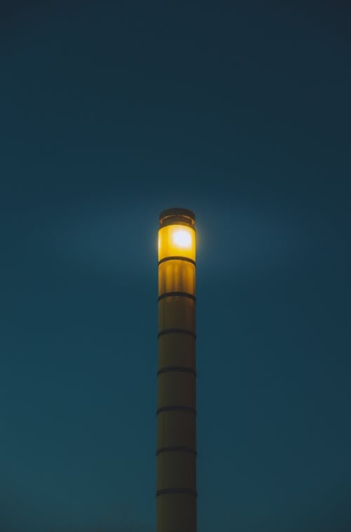 Modern beacon against night sky