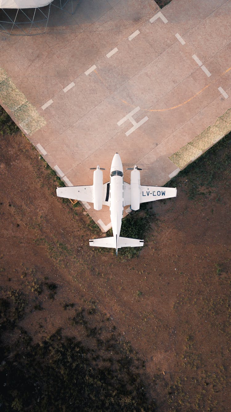 Light Aircraft On Edge Of Helipad