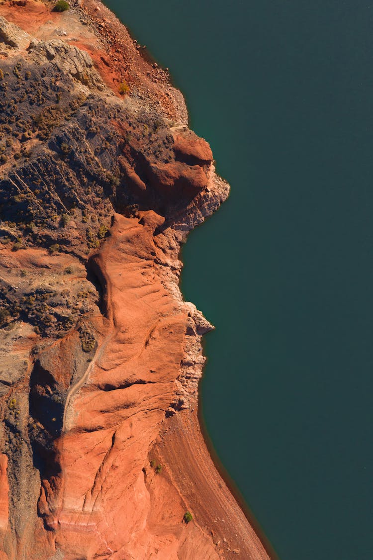 Rough Brown Rocky Formation On Gray Background