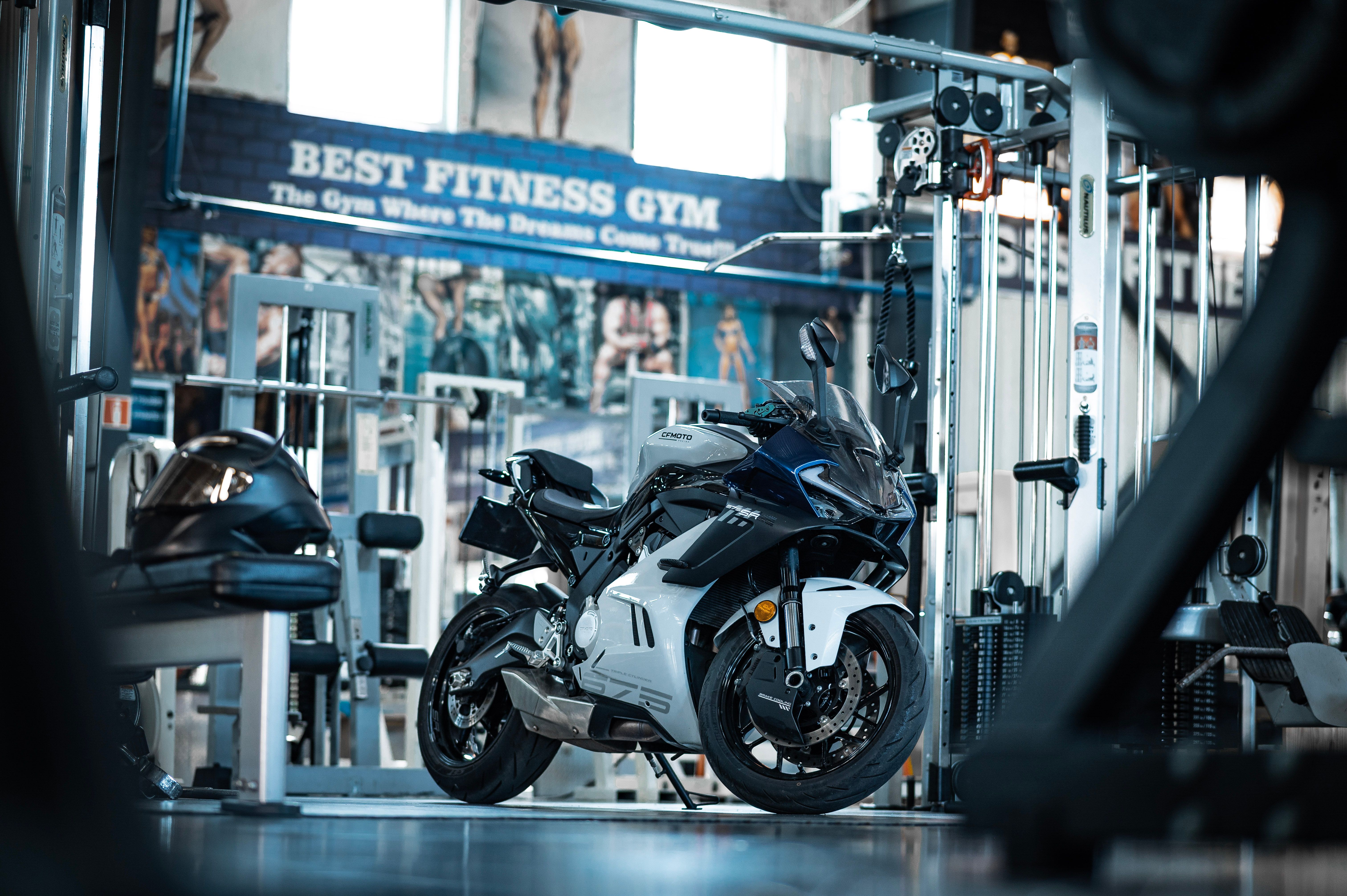 An elite performance coach conducting a precision fitness assessment in a luxury private gym setting.