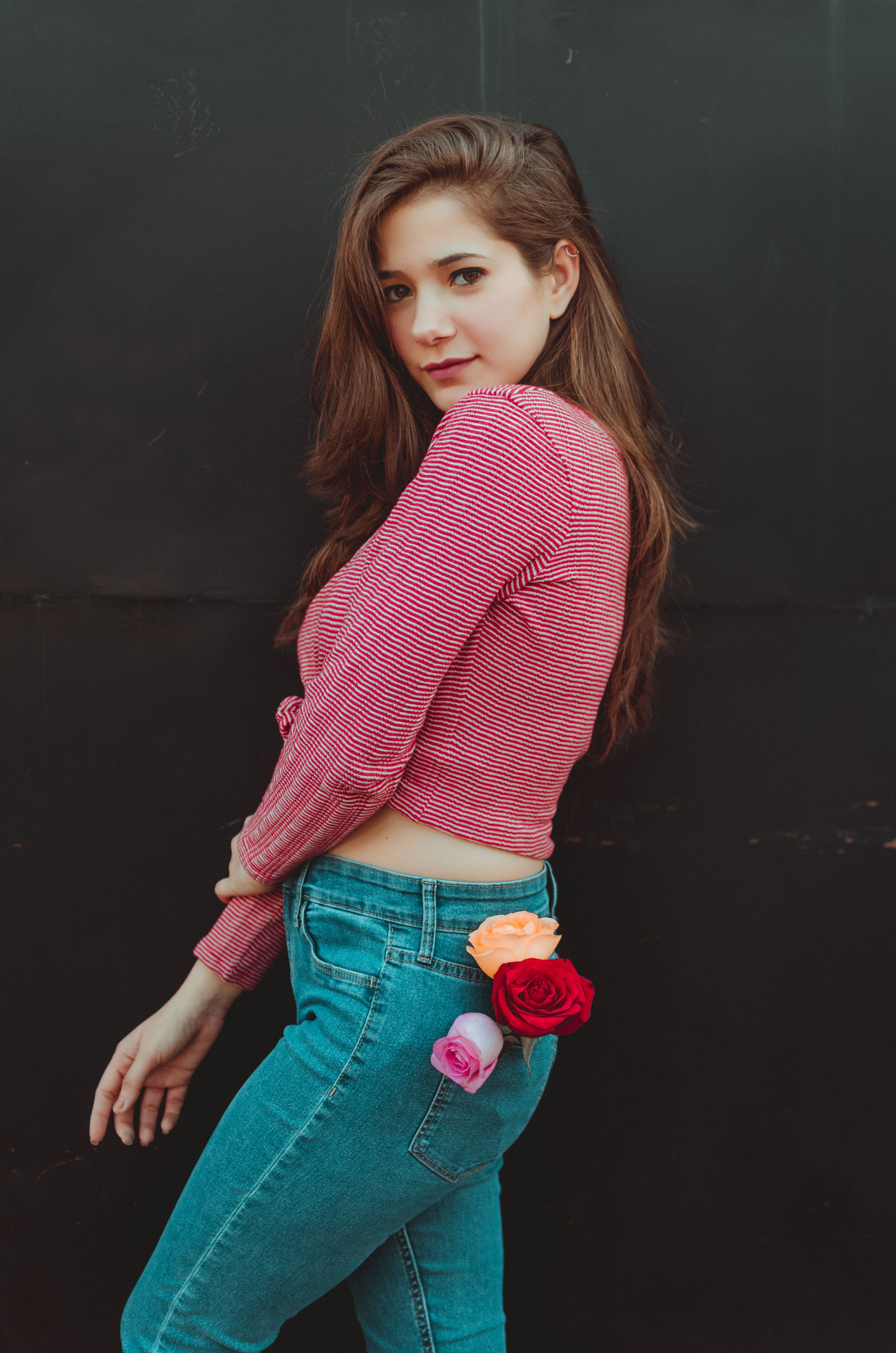 Woman In Red Long Sleeve Shirt And Blue Denim Jeans · Free Stock Photo