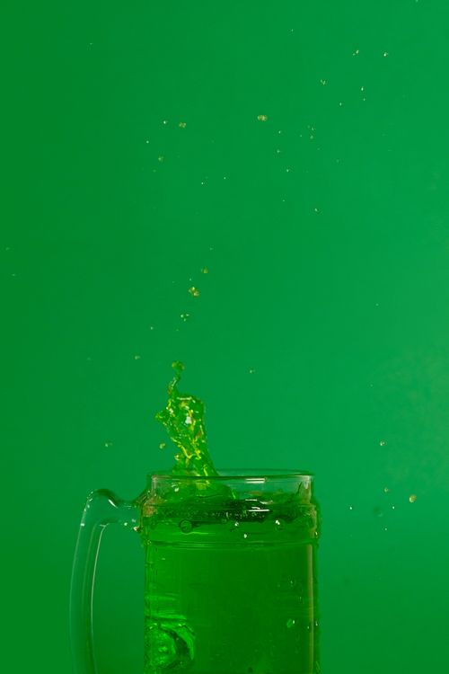Free A vibrant image of green beer splash, symbolizing fun and festivity for St. Patrick's Day. Stock Photo