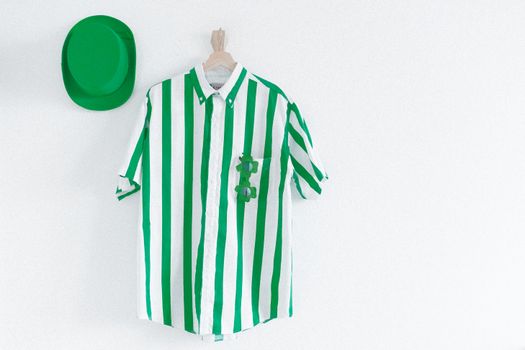 Green and white striped shirt with a green hat, perfect for St. Patrick's Day celebrations.