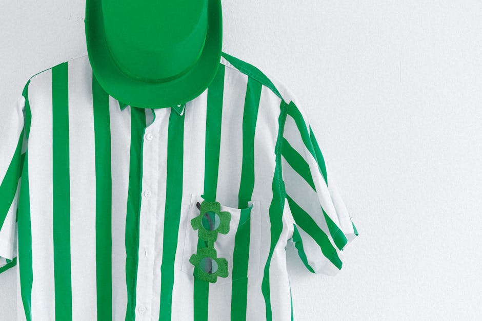 Green striped shirt with a green hat and shamrock glasses, perfect for St. Patrick's Day celebrations.
