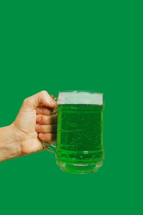 Free Person Holding Clear Glass Mug With Green Liquid Stock Photo