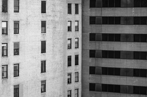 Free Monochrome view of urban building facades with windows, showcasing architectural design. Stock Photo