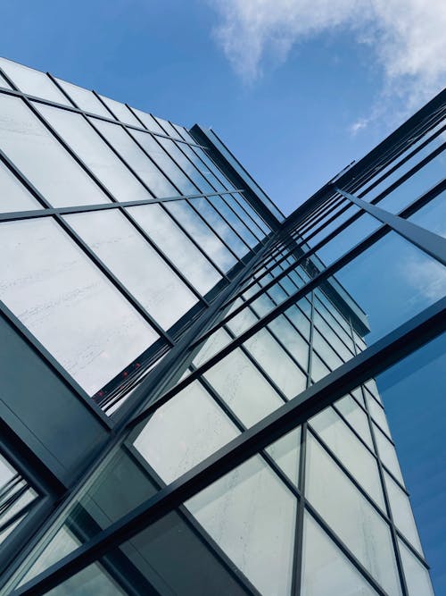 Low Angle Photography Of Glass Building