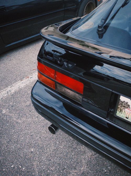 Free Black classic sports car parked in a West Palm Beach lot, showcasing retro automotive design. Stock Photo