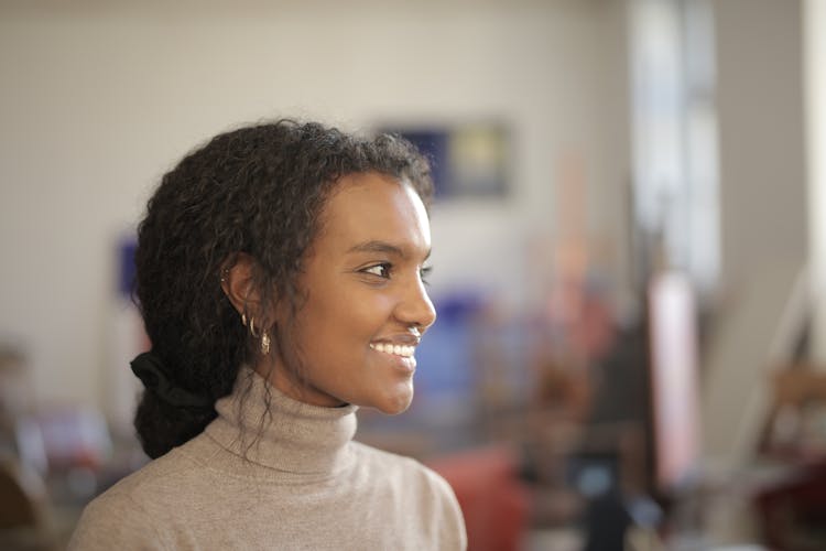 Happy Black Woman In Light Studio