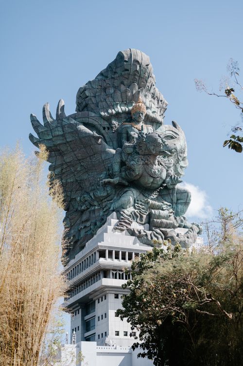 Free The Garuda Wisnu Kencana statue in Bali, a magnificent cultural landmark against blue skies. Stock Photo