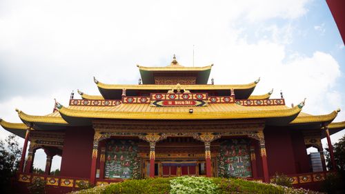 Free Front view of a vibrant Buddhist temple in Da Lat, Vietnam, showcasing intricate traditional architecture. Stock Photo