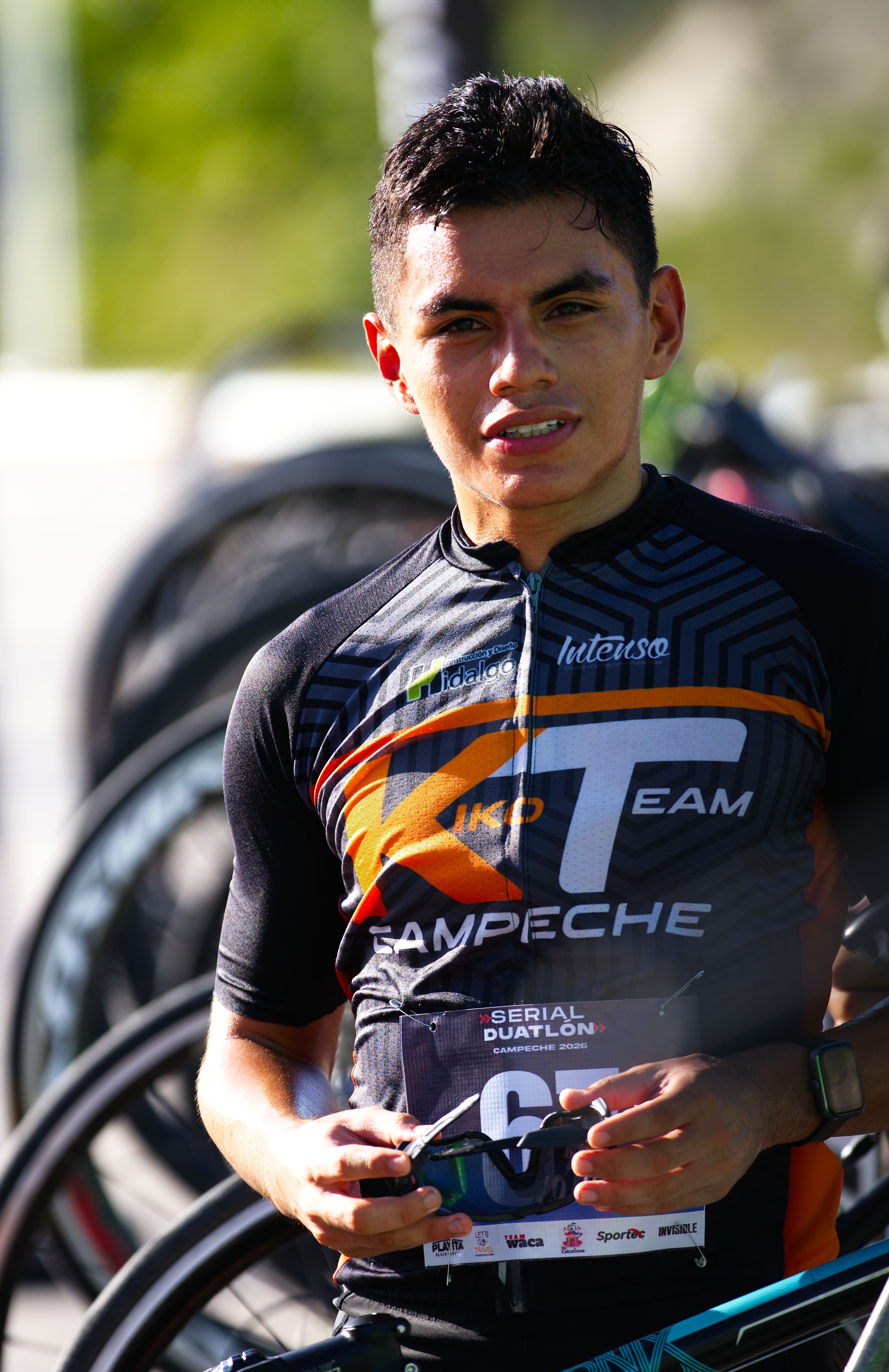 A young Hispanic athlete participates in a duathlon event, showcasing endurance and sportsmanship.