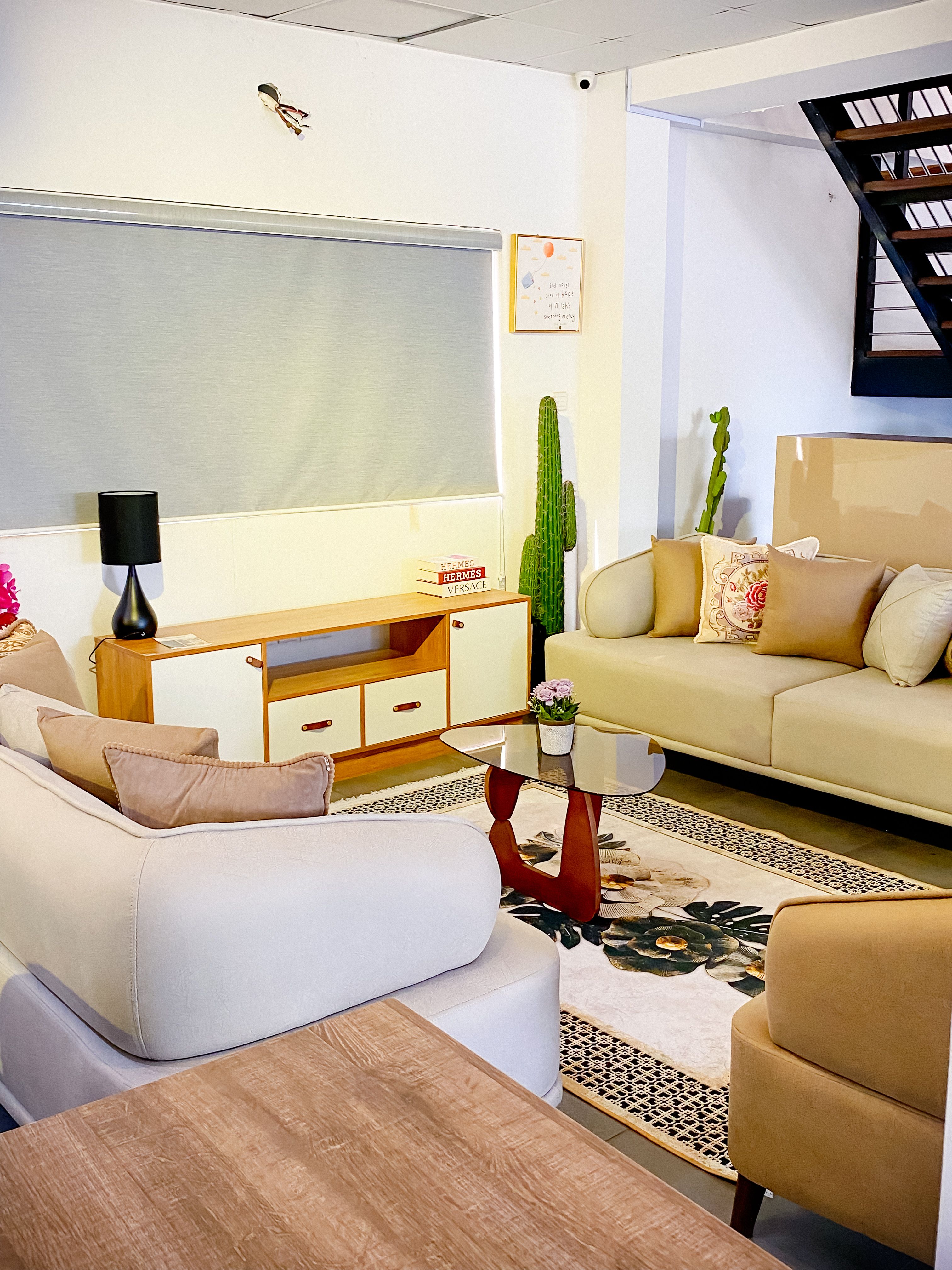 Bright neutral living room with modern sofa, coffee table and refined decor