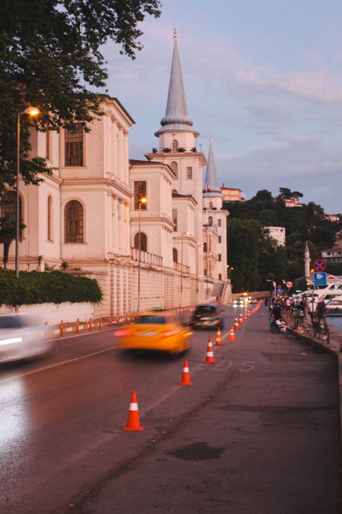 Free Bustling evening scene at the Kuleli Military High School in Istanbul with blurred cars and twilight sky. Stock Photo