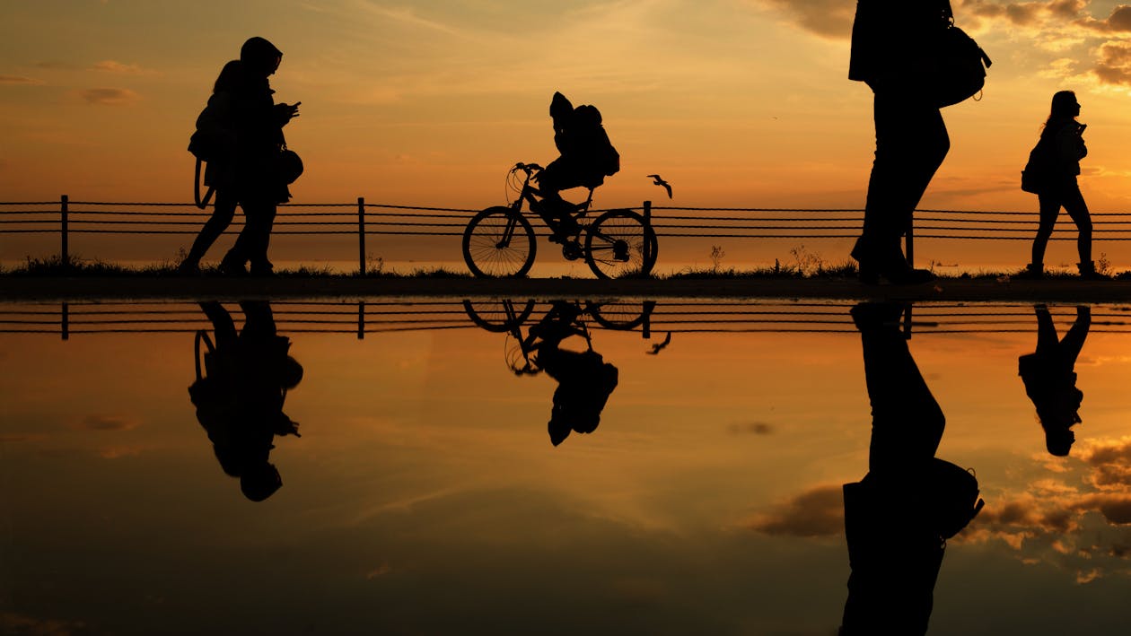 Silhouette of Man Riding a Bicycle