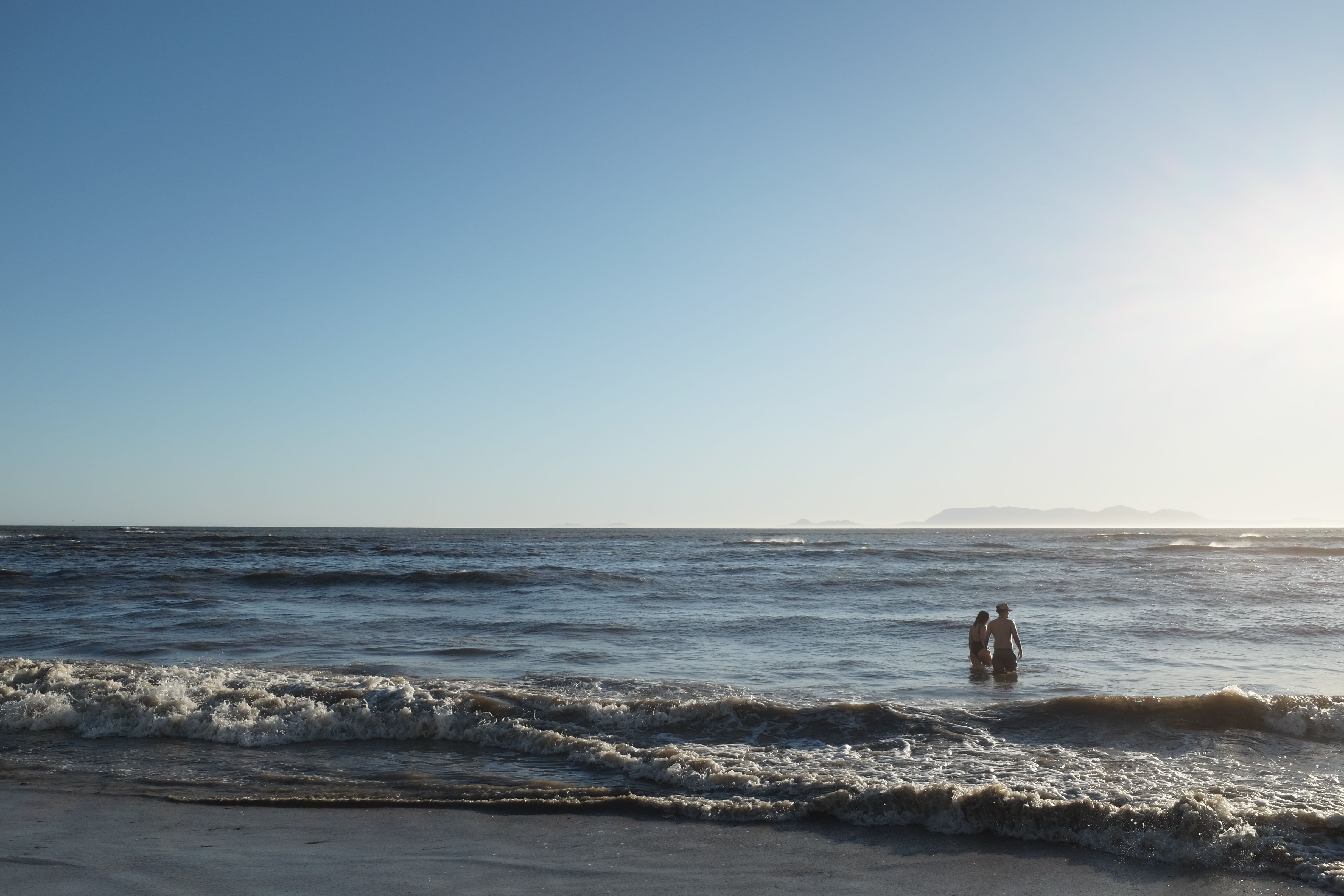 Couple enjoying a sunny day at a South African beach.