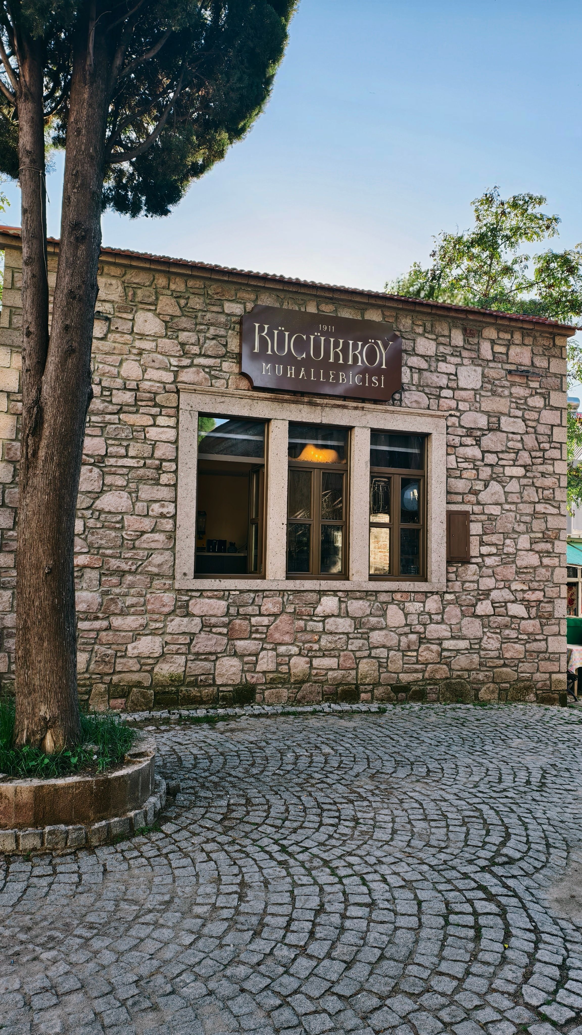 Traditional stone building facade in Küçükköy, Balıkesir, Türkiye with rustic atmosphere.