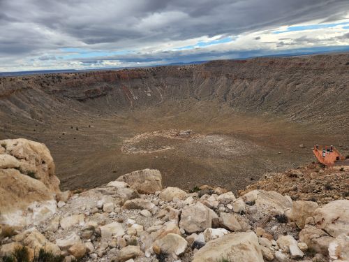 Free Stunning aerial view of the famous Meteor Crater in Winslow, Arizona, under a cloudy sky. Stock Photo