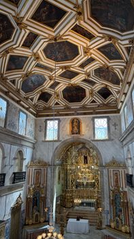A stunning view of a Baroque cathedral interior with elaborate ceiling and altar.
