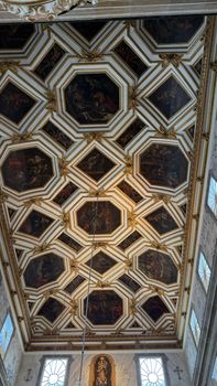 Detailed view of a geometric and artistic church ceiling showcasing intricate architectural design.
