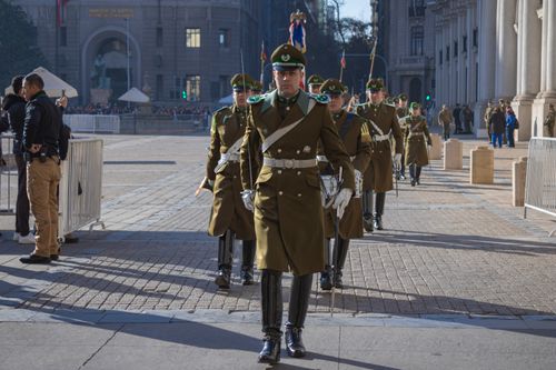 Free Chilean ceremonial guards parading in front of La Moneda Palace, Santiago, showcasing formal military attire. Stock Photo
