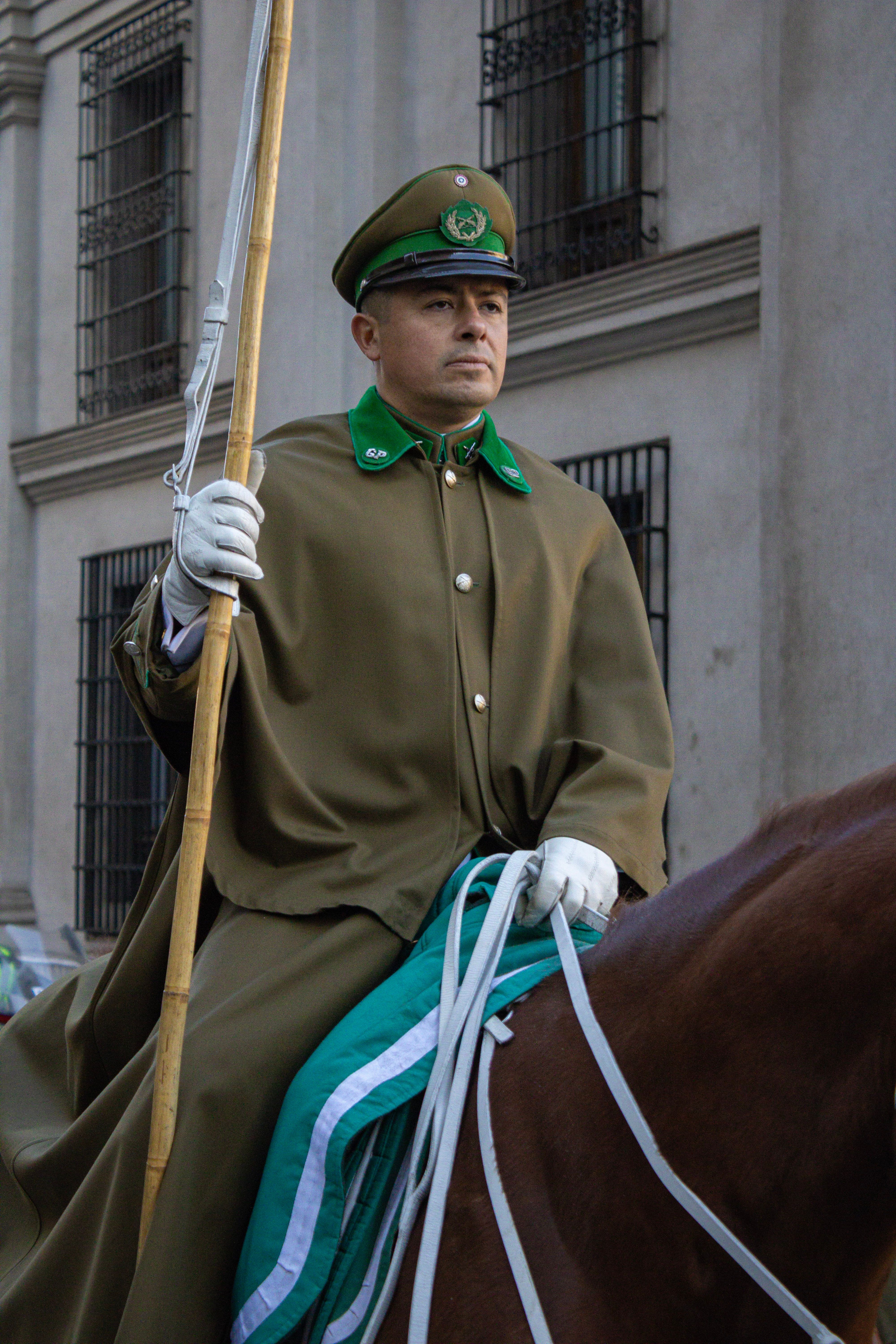 A member of the Chilean palace guard in ceremonial attire rides horseback in Santiago.