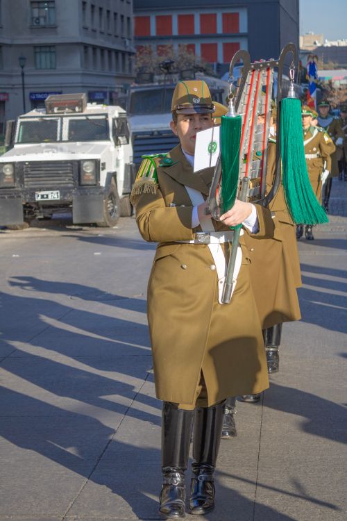 Free Military parade featuring police officers in formal attire marching in Santiago, Chile. Stock Photo
