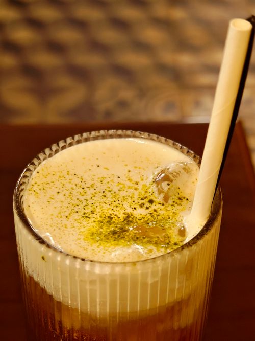 Free Close-up of an iced matcha drink in a glass with a straw, perfect for refreshment. Stock Photo