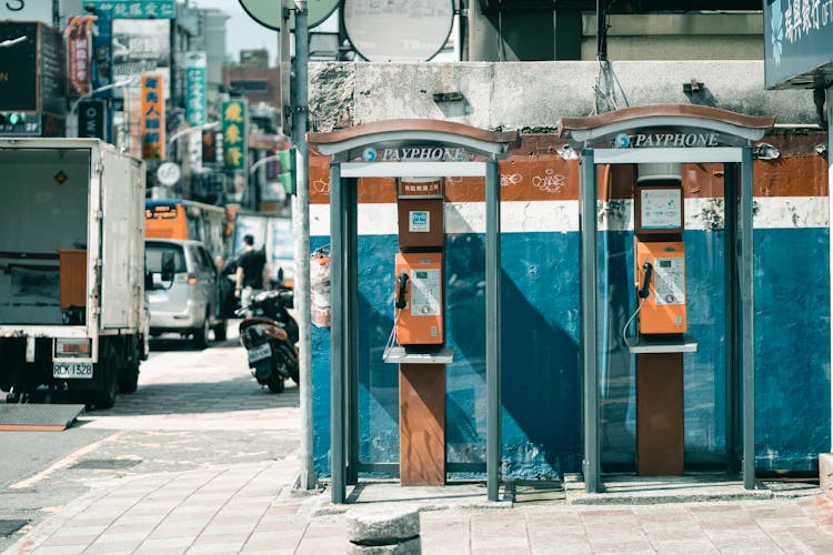 Similar Old Phone Booths Near Shabby Wall And Street Road