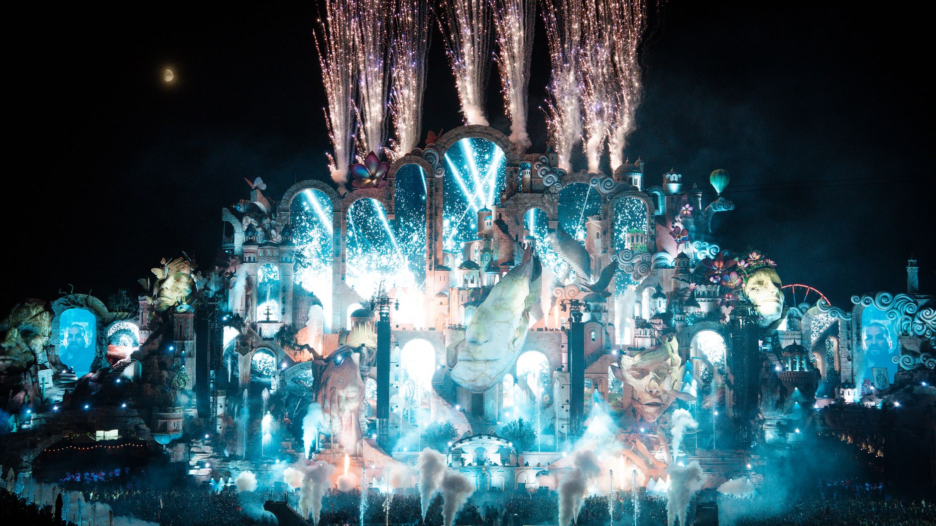 Vibrant fireworks illuminate the festival stage in Boom, Belgium. Electric night scene with colorful lights.