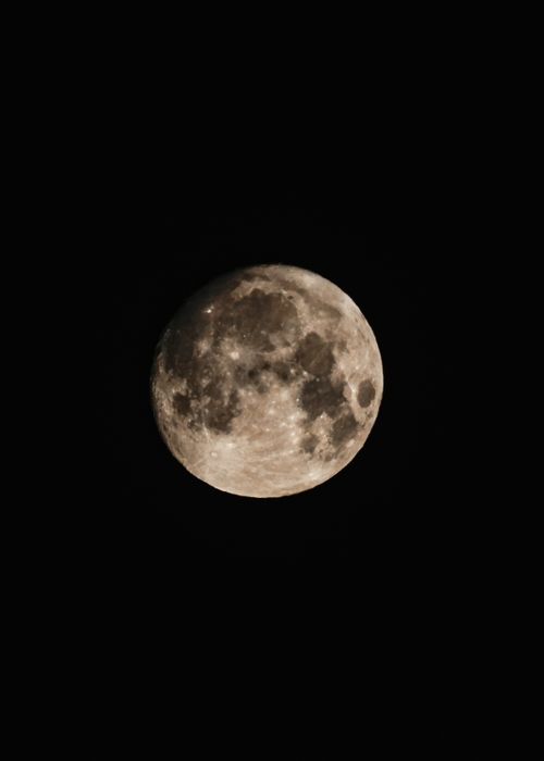Free A detailed capture of a full moon illuminating the night sky. Stock Photo