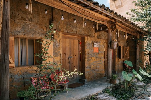 Explore the rustic charm of a traditional home in Lũng Cú, Vietnam with its wooden fixtures and vibrant details.