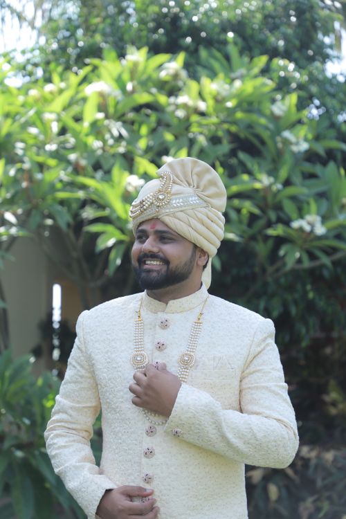 Free A joyful Indian groom in traditional wedding attire and turban outdoors in Gujarat. Stock Photo