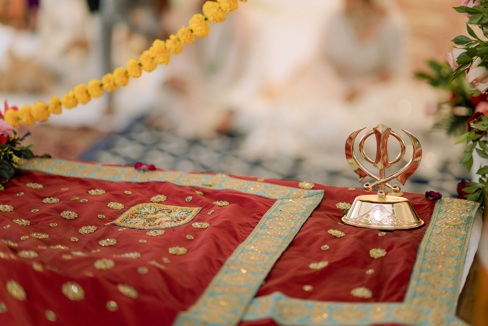 Red Rumala Sahib with gold zari embroidery and a gold Khanda