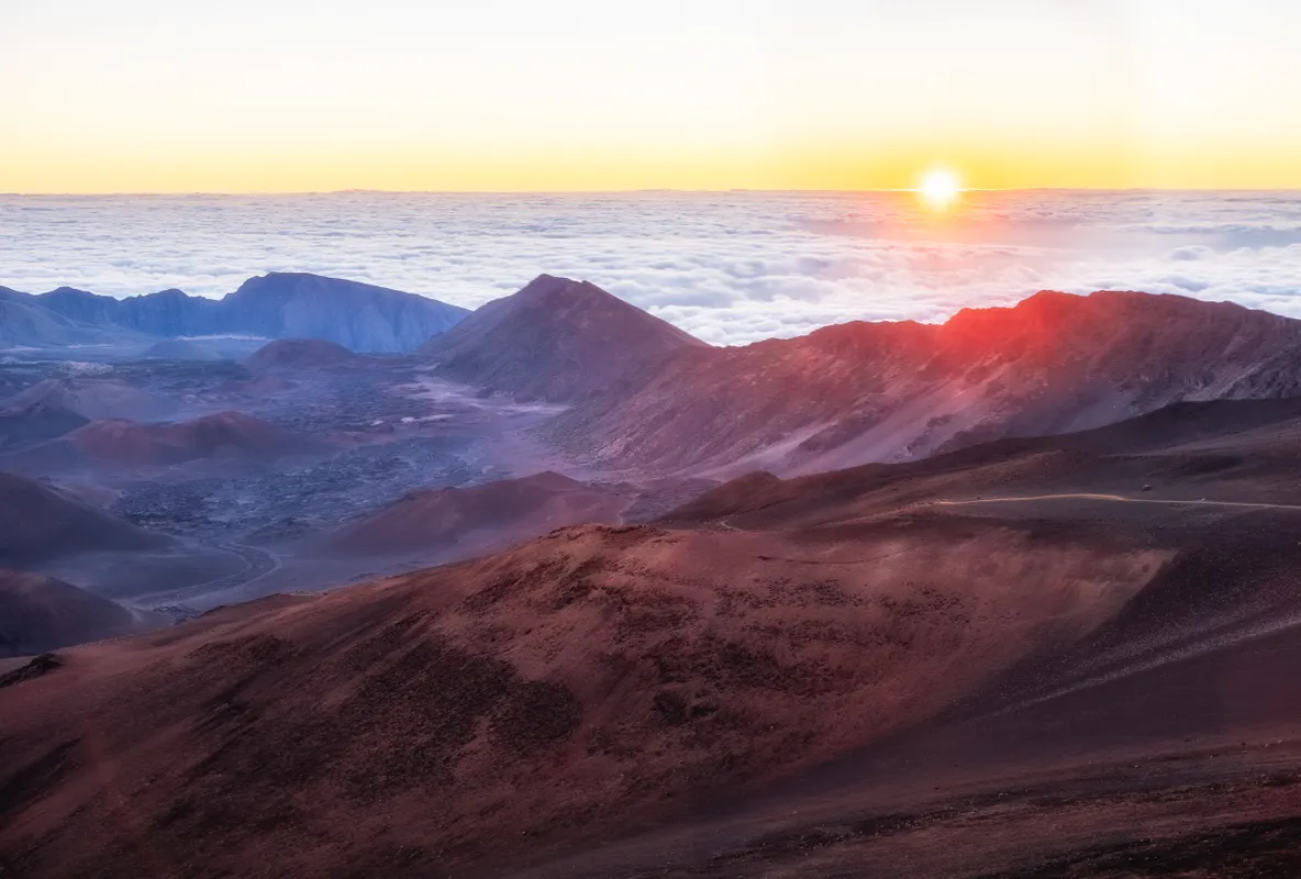 Sunrise above the clouds over Haleakala Crater on Maui, Hawaii