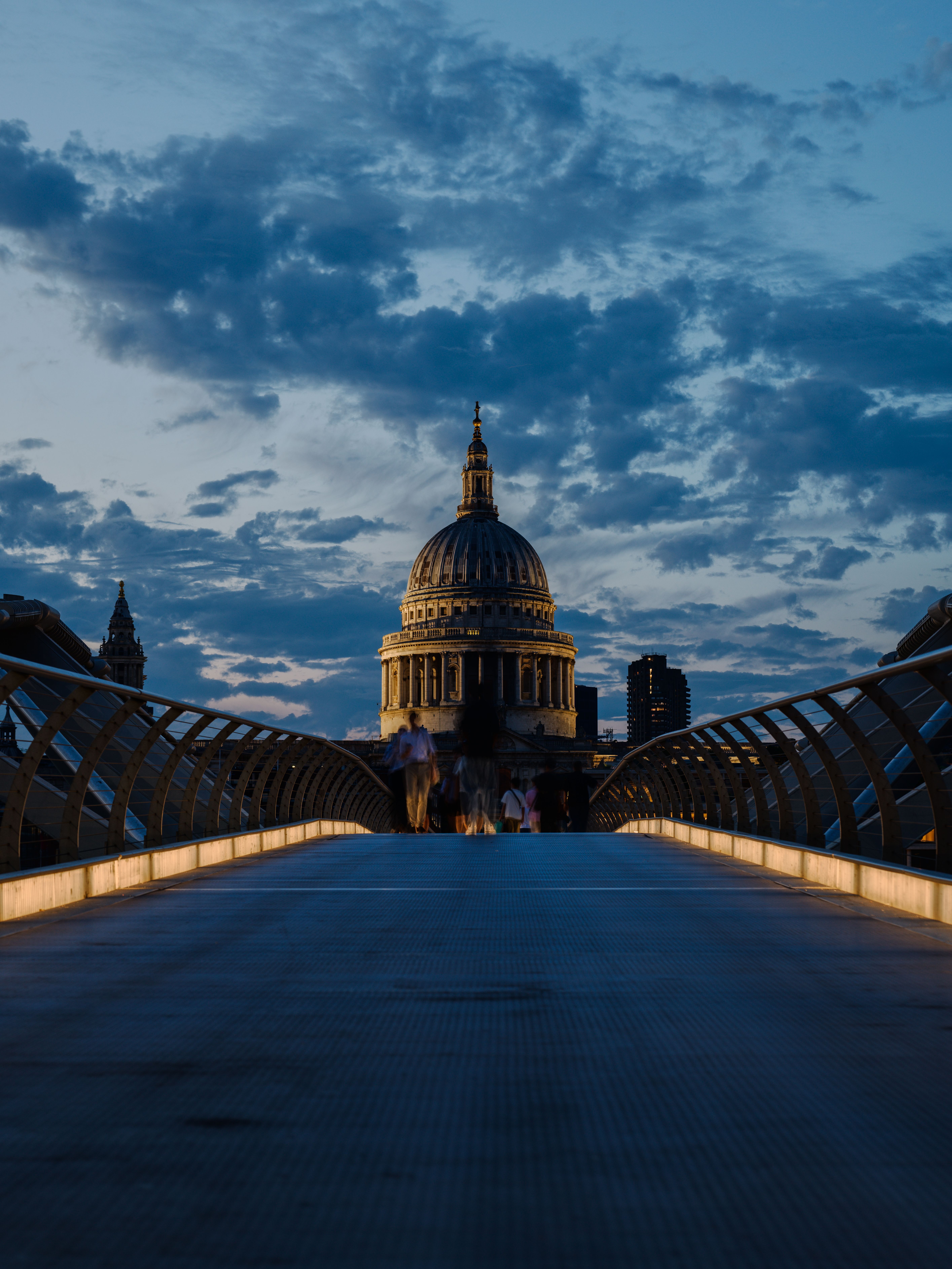 Dramatic twilight view of St. Paul's Cathedral from Millennium Bridge in London, England.