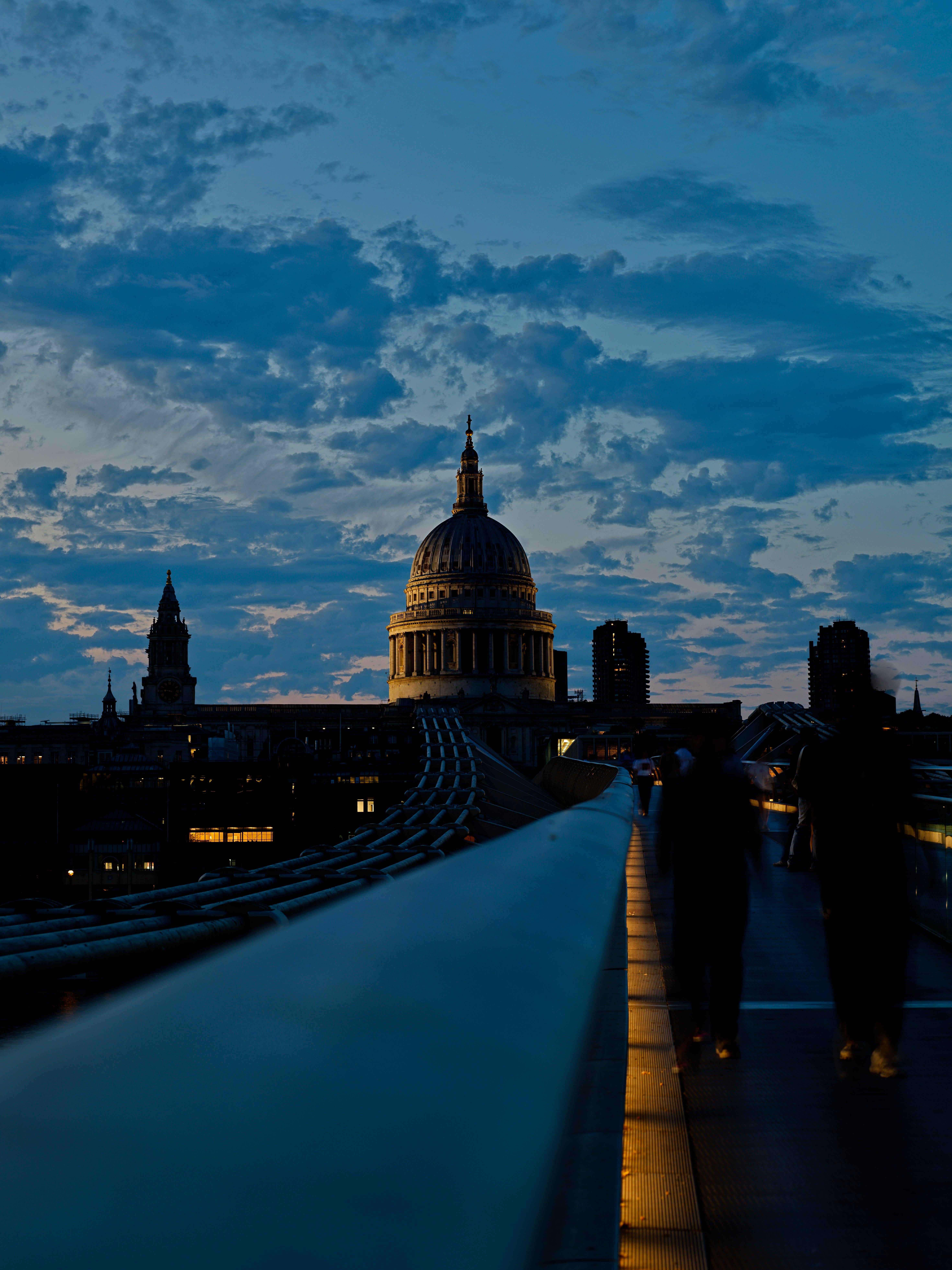 Dramatic view of St Paul's Cathedral during twilight from Millennium Bridge, London.
