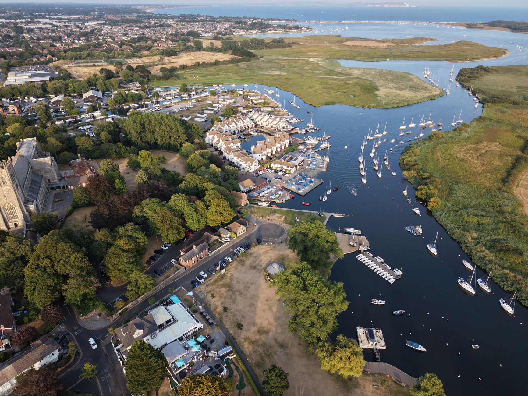 Aerial view of Christchurch Harbour, marina, and church