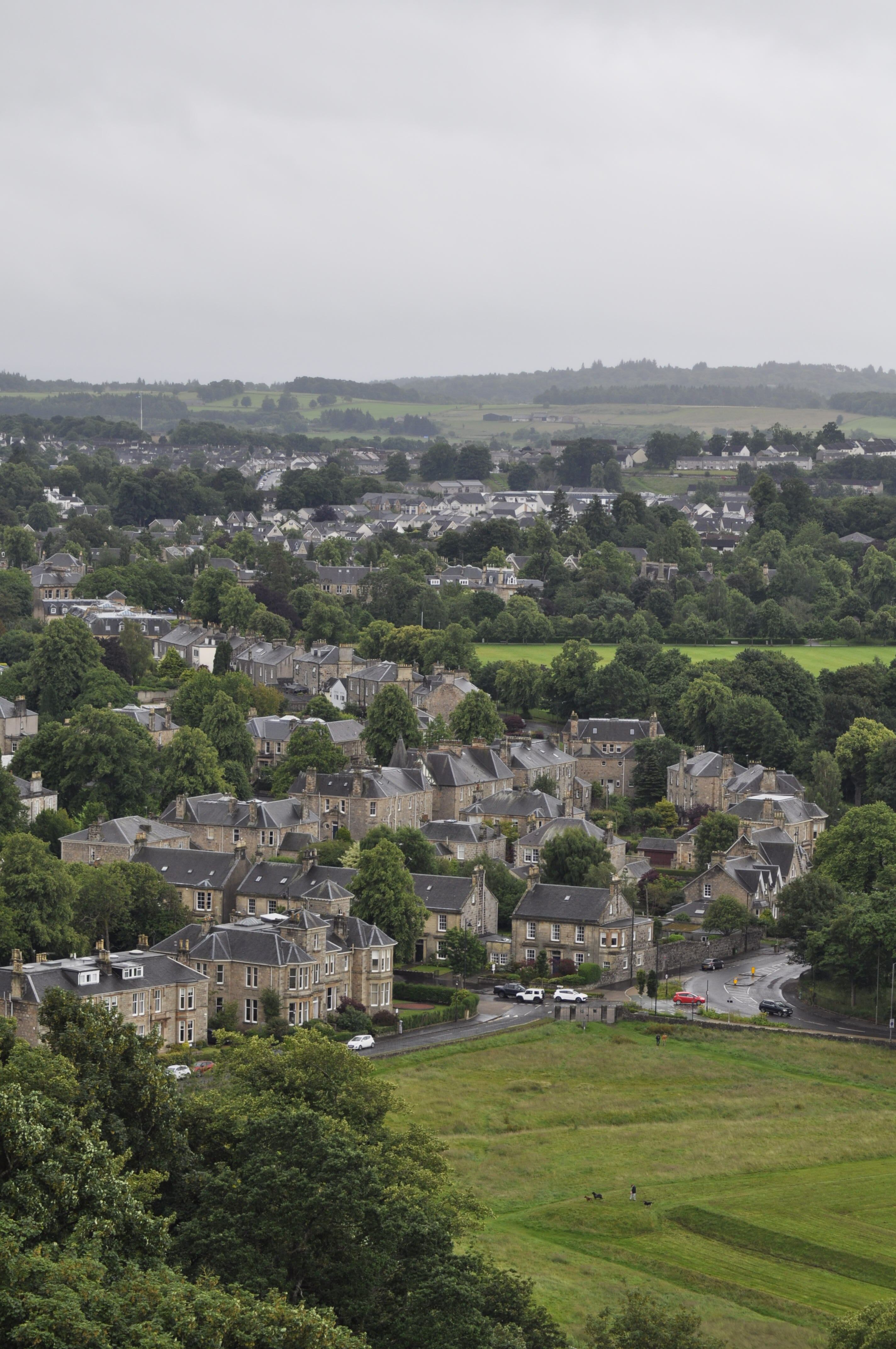 Beautiful aerial view of historic Stirling, showcasing classic stone buildings and lush countryside.