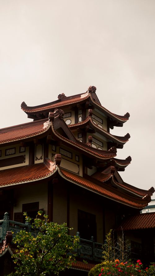 Free Stunning view of traditional pagoda architecture against a moody sky in Ho Chi Minh City, Vietnam. Stock Photo