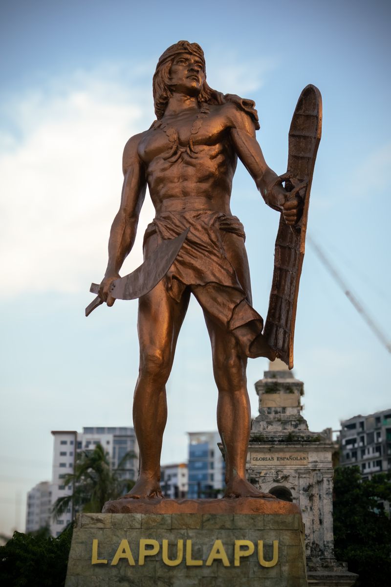 Bronze Lapu-Lapu statue holding a sword and shield at Mactan Shrine