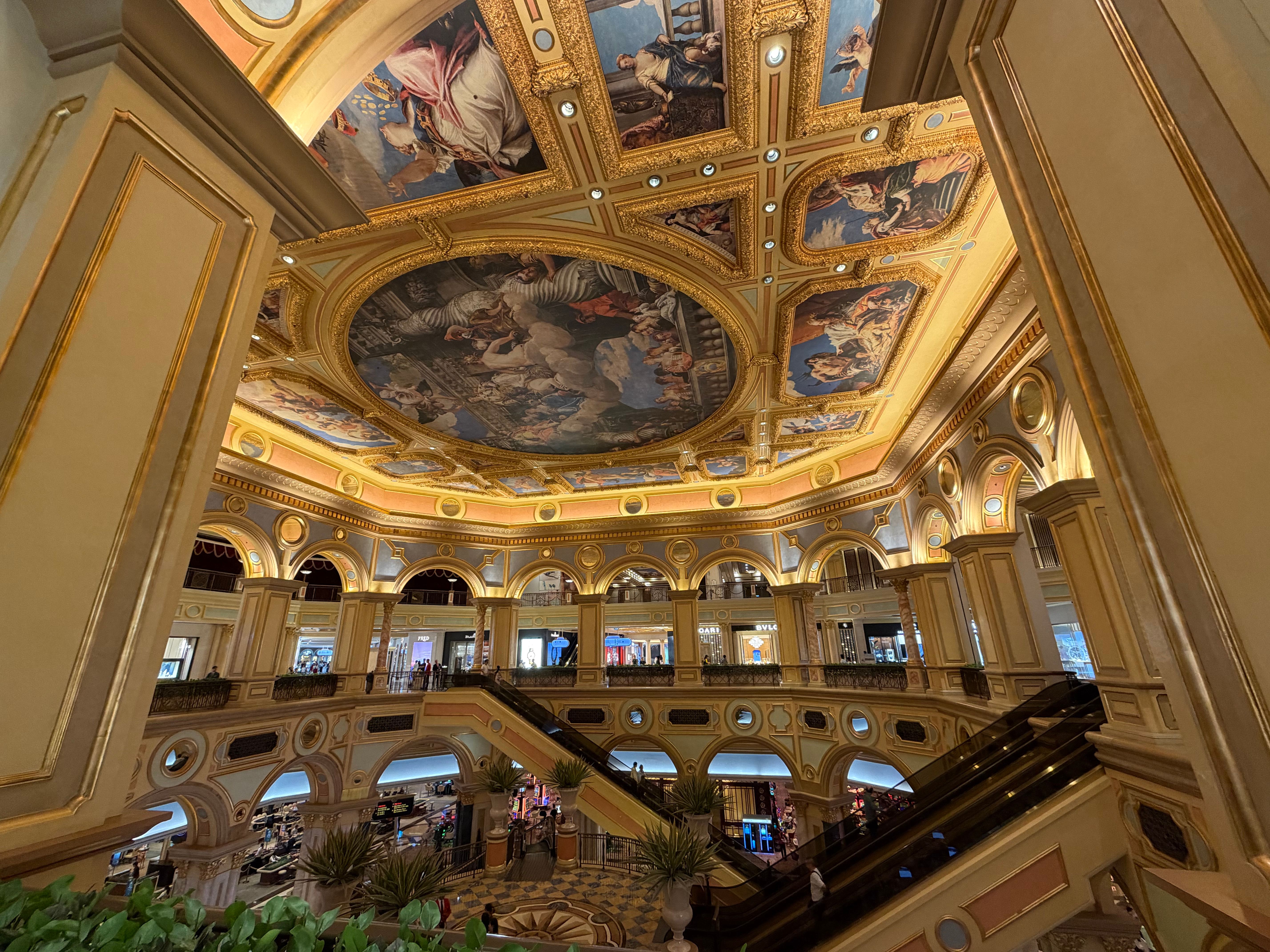 Elegant view of the ornate ceiling and architecture inside the Venetian Macao shopping area.